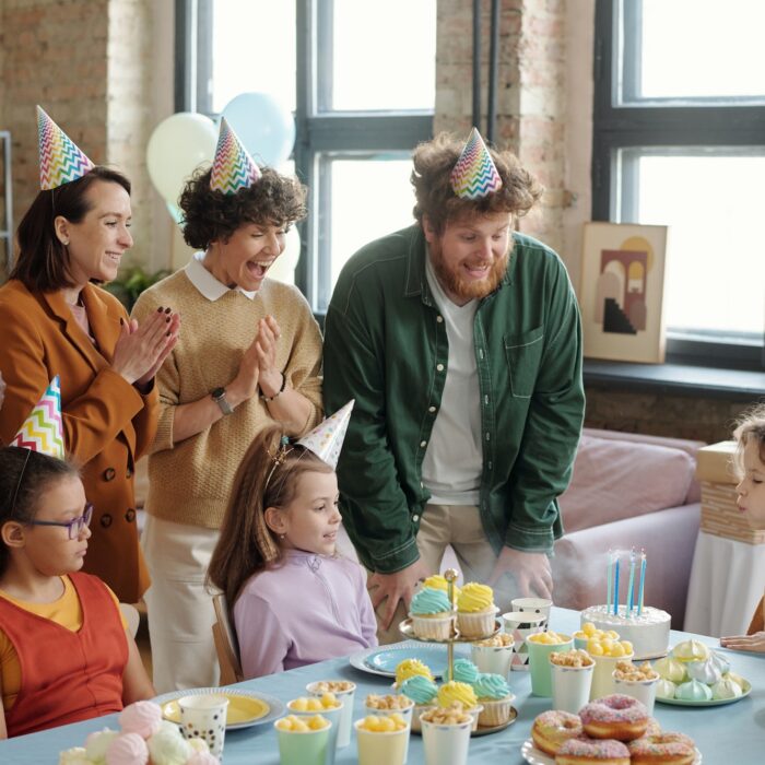 Friends congratulating boy with birthday